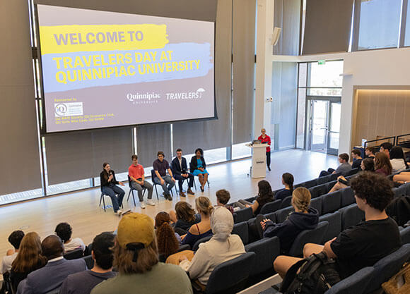 A panel discusses Quinnipiac's relationship with Travelers.