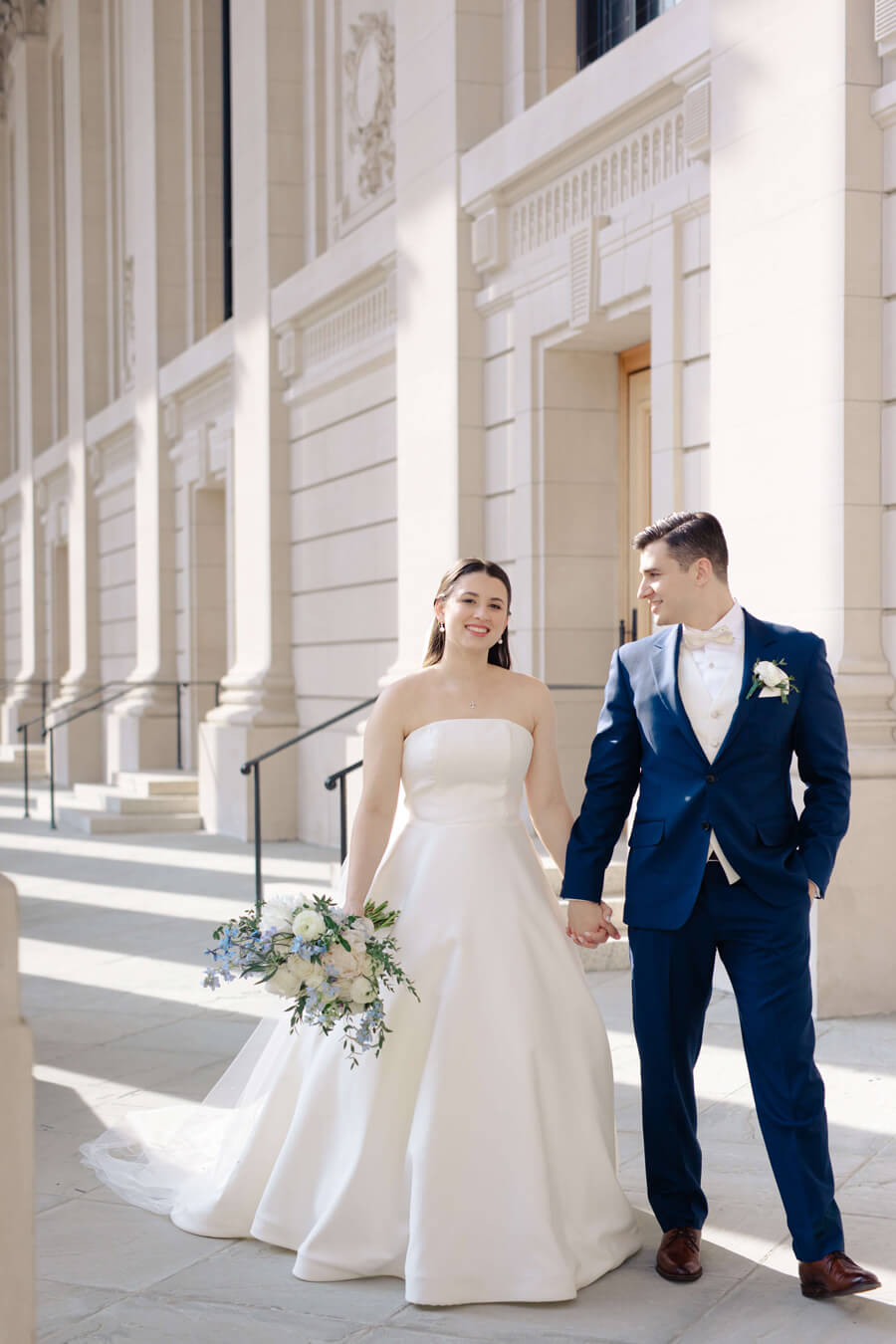 Ephemia Nicolakis and Loukas Agoris hold hands on their wedding day