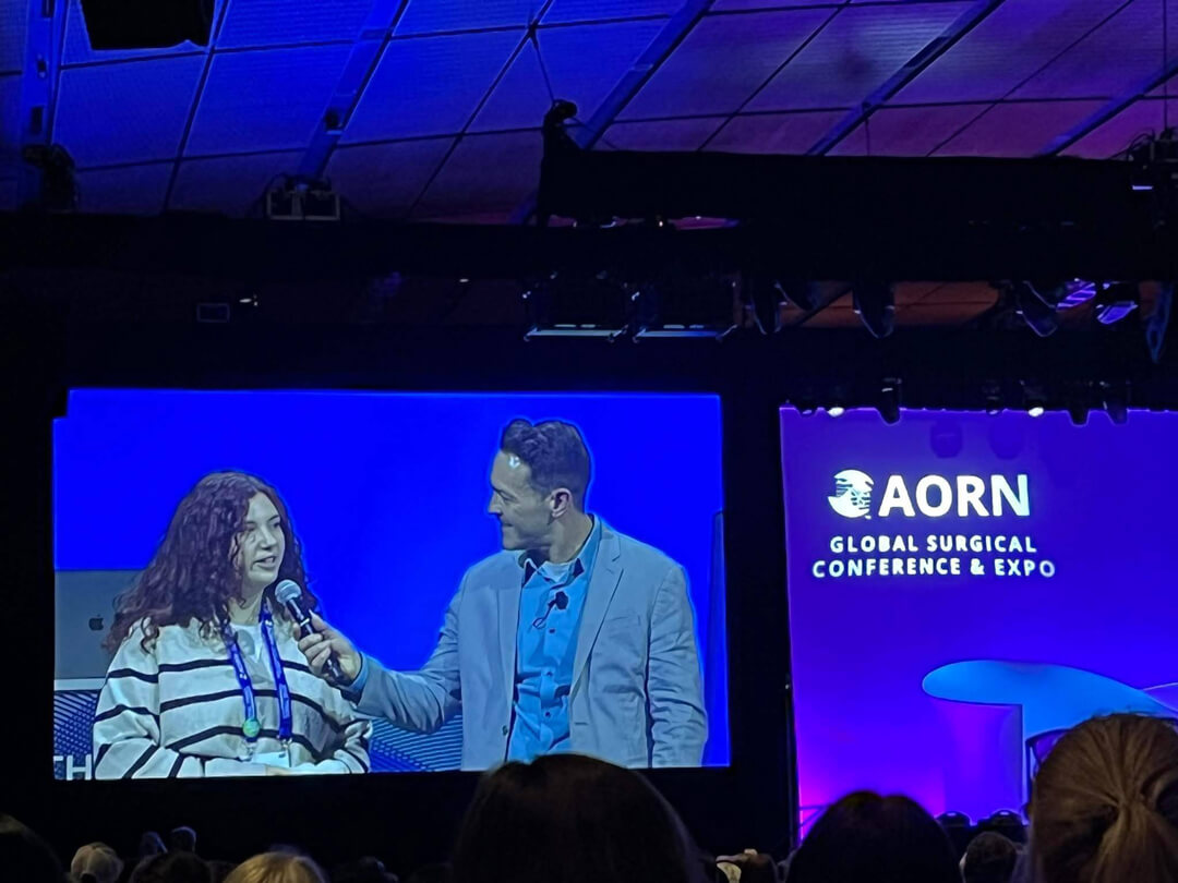 Kimberly	Lebel onstage being interviewed at the Global Surgical Conference & Expo