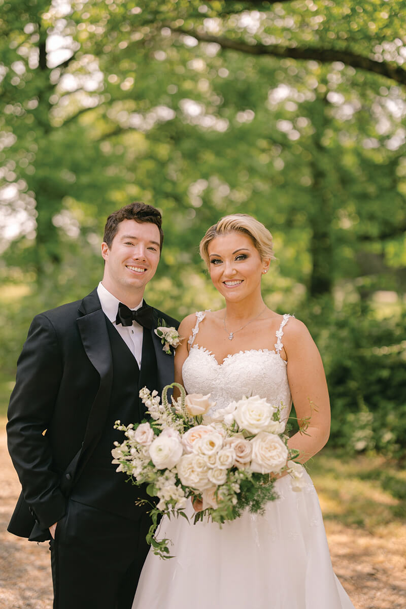 Alex (Larsen) Hull and her husband pose for a photo together on their wedding day