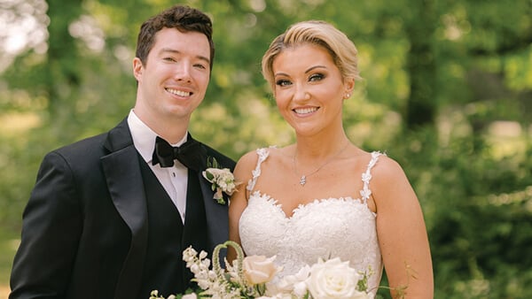 Alex (Larsen) Hull and her husband pose for a photo together on their wedding day